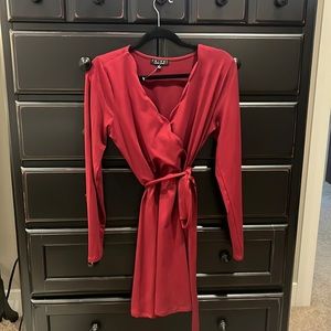 Adorable long sleeve dress with flattering shape. Size large.